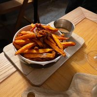 Sweet potato fries with vegan mayo and sun dried tomatoes   at Kohvik Must Puudel in Tallinn