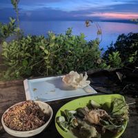 Spicy aubergine and organic red rice at Buzzz Cafe in Panglao