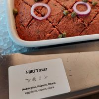 The first symbol indicates a vegan option at Hiltl - Dachterrasse in Zurich