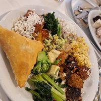 Plate with Samosa, Springrolll, Srambled eggs, veggies, at Hiltl - Dachterrasse in Zurich