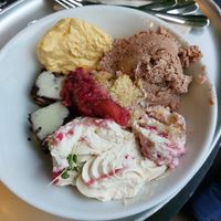 Mango and chocolate mousse, brownies with vanilla sauce, raspberry and peach crumble and raspberry tiramisu at Hiltl - Dachterrasse in Zurich