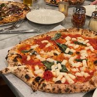 Margherita pizza with cashew cheese, veggie pizza with cashew cheese on left!  at Pizza Barbone in Hyannis