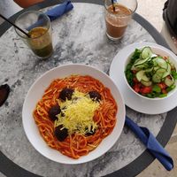 Spaghetti with lentil "meat balls" and vegan cheese. at Nigella Bistro in Benalmadena