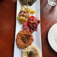 Oriental plate with dolmas, snowballs in the deserts, pickle plate, muhamarra and hummus  at Cafe Turko in Seattle