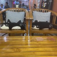 More cat plushies opposite the sofa  at The Black Cat Cafe in Kuala Lumpur