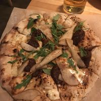 Dulce Picante Wood Fired Pizza with  fig jam, spicy red pepper, pear, Gorgonzola, honey arugula.  at The Butcher's Daughter in Venice