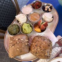 Spread of delicious fresh bread and… well… spreads. A bread and spread spread, if you will.  at Nocturno Cafe in Jerusalem