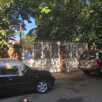 White gate to courtyard  at Casita Ecovegana de Zihuatanejo Cooperativa in Zihuatanejo