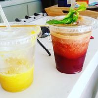 Juices named "sunshine" and "red" at Natural Cafe in Marigot