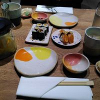 Some of the sushi pieces, which were part of a menu of many different sushi pieces. Left: pot with lemon-ginger tea. at Youmiko Vegan Sushi - Hoża in Warsaw
