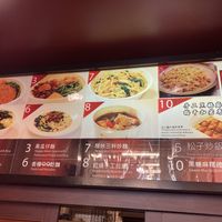 Menu over the till has English translations and photos at Sù Xīn Yuán in Taichung