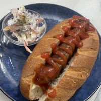 Vegan sausage with coleslaw instead of sauerkraut    at Herbee's Garden Cafe in Hahndorf
