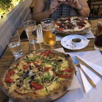 The front pizza is the vegan veggie which was delicious and really cheesy. The back pizza was a dairy and meat pizza which my omni friend said was great. at Mystic All Day Cafe in Athens