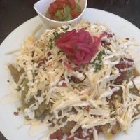 Chilaquiles with salsa verde and chorizo  at The Pitted Date in Playa Del Carmen