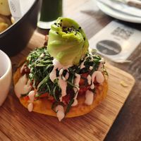 Half of a bagel sandwich at The Pitted Date in Playa Del Carmen