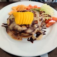 Hot cakes with choco monkey topping at The Pitted Date in Playa Del Carmen