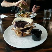 Waffles with banana and berries at The Pitted Date in Playa Del Carmen
