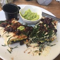 Breakfast burrito- always forget to take pics before I start. This was straight-up delicious. at The Pitted Date in Playa Del Carmen