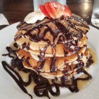 The gluten-free hotcakes with choco monkey topping...deeeelicious! at The Pitted Date in Playa Del Carmen