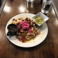Chilequiles with vegan egg and vegan chorizo at The Pitted Date in Playa Del Carmen