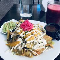 Chilaquiles with vegan egg and green sauce at The Pitted Date in Playa Del Carmen