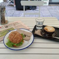 Avocado sandwich, cappuccino with a glass of water and Der Standard - How could this not be a great start of the day  at Ginko - Greenhouse in Graz