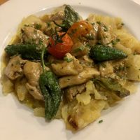 Heura (chickenless) with delicious sauce and sliced potatoes .  at Hicuri in Granada
