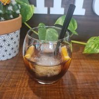 Delicious local vermouth with soda and orange at Hicuri in Granada