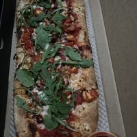 Vegan pizza topped with pepper, mushroom, tomato, arugula  at &pizza - U St in Washington