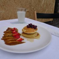 Pancakes caramelized apple and strawberries at Powoli in Wroclaw