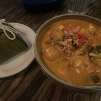 Massamam veggie and tofu curry with rice wrapped in banana leaf  at Pai Toronto in Toronto