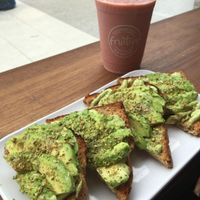 Avocado Toast with basil/avocado pesto - smoothie on the side... at Fruitive - Palmer Alley in Washington