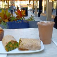 Banana nut chocolate chip muffin, southwest wrap with kale, broccoli, sweet potatoes, and cashew cheese, and a coffee date smoothie. Incredible aroma not shown. at Fruitive - Palmer Alley in Washington