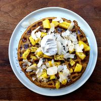 Mango waffles with maple syrup, coconut and and coconut cream at Fruitive - Palmer Alley in Washington