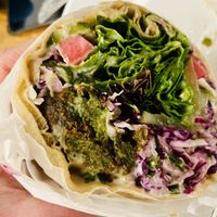 Falafel Wrap. This was only half of it. It was really big and the falafel was perfectly spiced. Mediterranean slaw, lemon pickles, pickled turnips, taum, wrapped in lavash.   at B52 Cafe in Pittsburgh