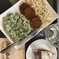 Variations of foods offered as menu and a cake at Veggie Nyers in Budapest