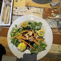 Burger crudisti di carote, mandorle e pomodori secchi, sopra crema di anacardi e curcuma  at L'Orto Gia Salsamentario in Turin