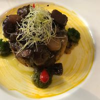 Seitan in wine sauce served with a potato patty at L'Orto Gia Salsamentario in Turin