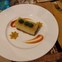 Raw mango cheesecake dessert at L'Orto Gia Salsamentario in Turin