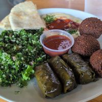 Veggie plate (sub spanatopika for more falafel) with a side of spicy hummus, tabouleh, and fluffy pita at Sahara Greek & Lebanese Cafe in Tallahassee