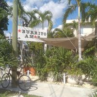 Outdoor streetcorner seating at Burrito Amor in Tulum