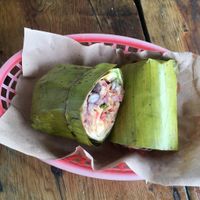 Vegan burrito wrapped in banana leave at Burrito Amor in Tulum