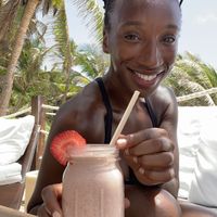 @TierraGoesGreen enjoying her strawberry & cream smoothie.  at Sanara  in Tulum