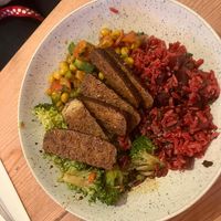 Tofu with three salads  at The Natural Food Deli in Petersfield