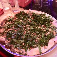 White pizza (without cheese) topped with garlic, spinach, and mushrooms at Piola in Playa Del Carmen