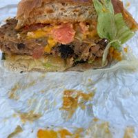 Curbside Burger (housemade patty, cheese, lettuce, tomato, pickle, special sauce at Reverie Cafe + Bar in Minneapolis