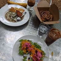Goldielox bagel, biscuits & gravy, HUGE cinnamon roll. at Reverie Cafe + Bar in Minneapolis