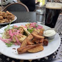Cauliflower tacos with potato wedges   at Reverie Cafe + Bar in Minneapolis