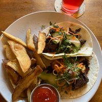 Korean BBQ Mock Duck Tacos. Outstanding. Gochujang BBQ mock duck, pickled veggies, radish, cilantro, flour tortillas. at Reverie Cafe + Bar in Minneapolis