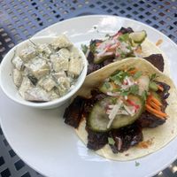 Mock duck tacos w potato salad   at Reverie Cafe + Bar in Minneapolis